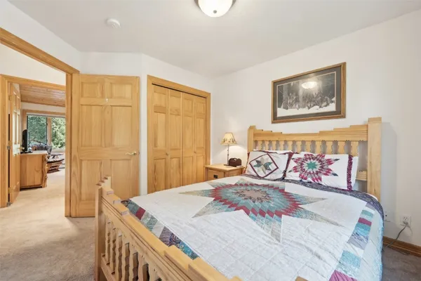 a bedroom with a bed and a table
