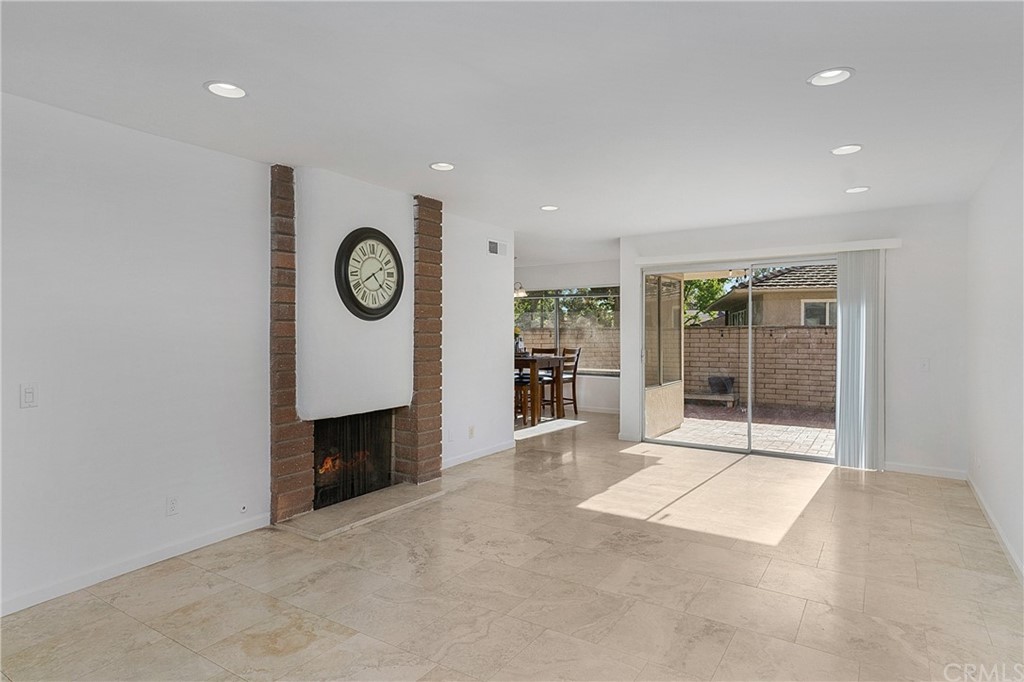 17241 Candleberry Irvine, CA 92612 - Photo 15 of 24 a view of an empty room with a window and fireplace