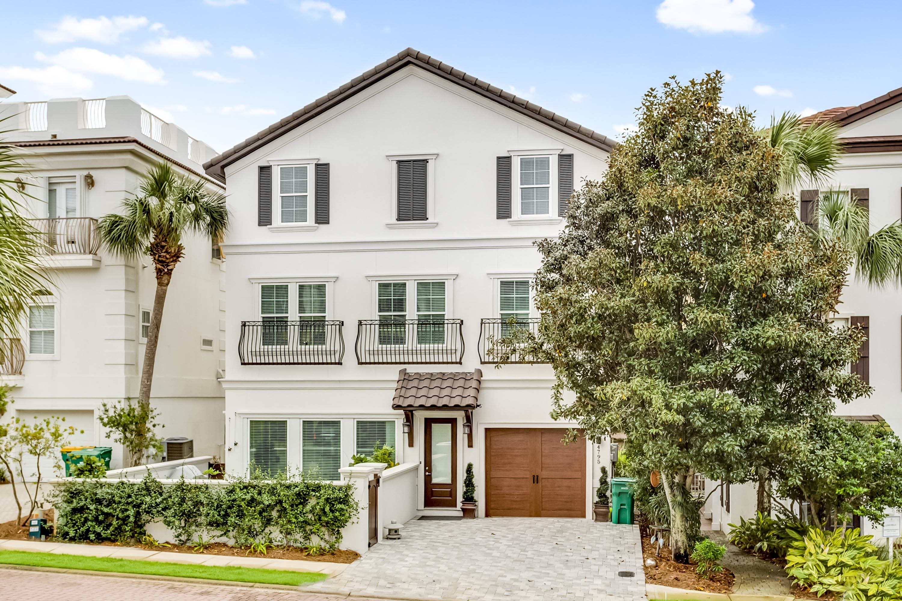 4795 Ocean Boulevard Destin, FL 32541 - Photo 1 of 43 front view of a house with a tree