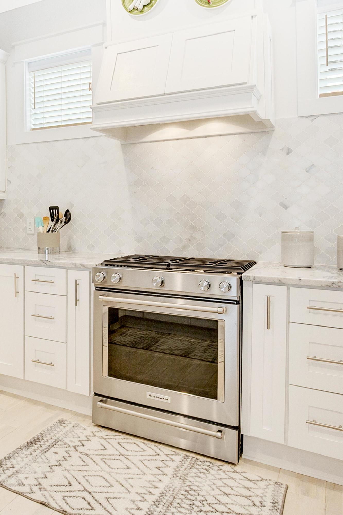 4795 Ocean Boulevard Destin, FL 32541 - Photo 12 of 43 a stove top oven sitting inside of a kitchen