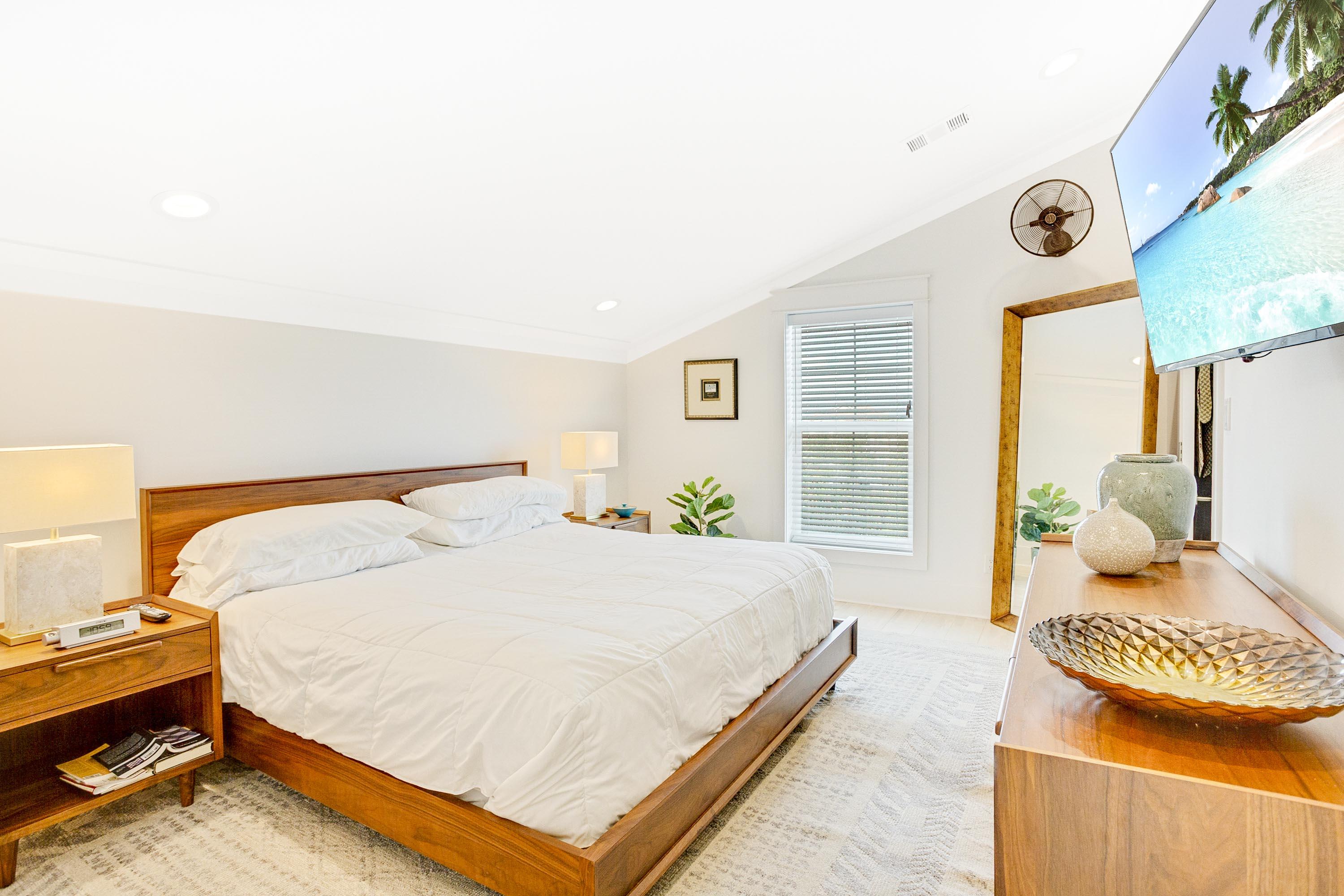 4795 Ocean Boulevard Destin, FL 32541 - Photo 17 of 43 a bedroom with a bed and dresser with mirror
