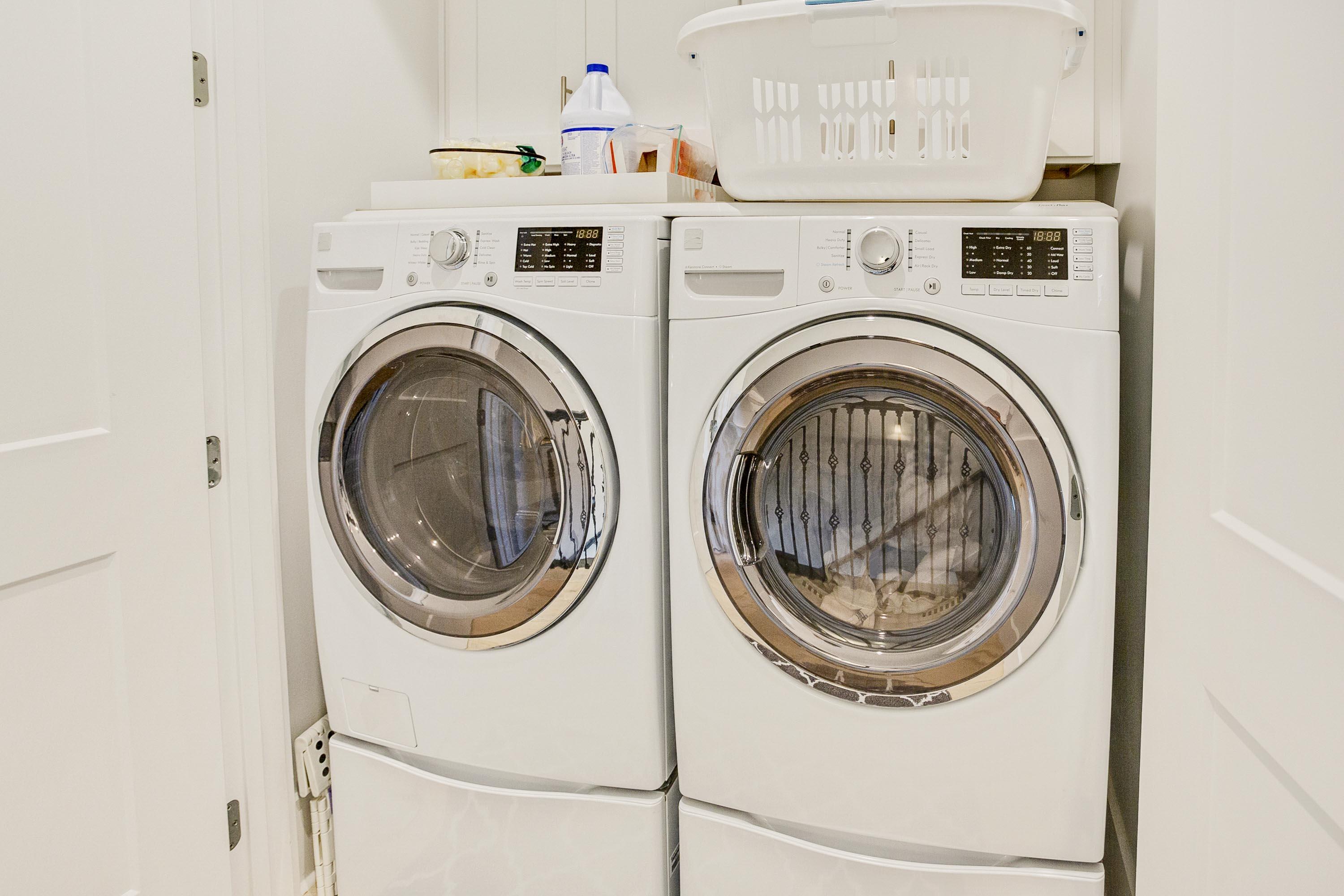 4795 Ocean Boulevard Destin, FL 32541 - Photo 25 of 43 a view of washer and dryer with kitchen in the background