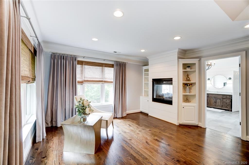 18408 Dembridge Drive, Unit 21 Davidson, NC 28036 - Photo 16 of 34 a living room with furniture and a flat screen tv