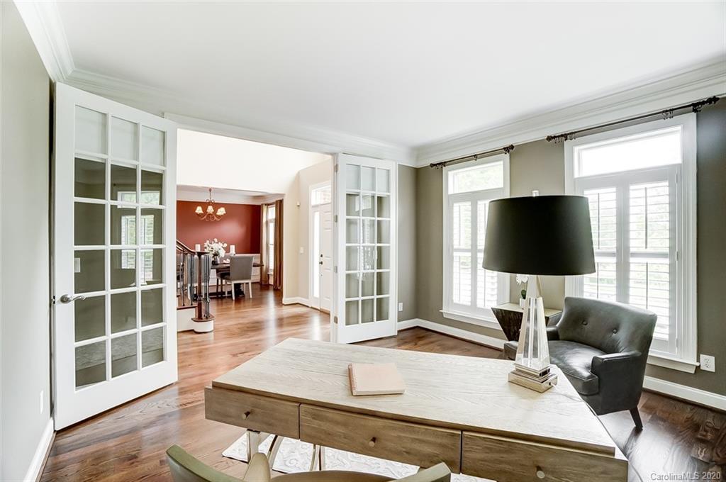 18408 Dembridge Drive, Unit 21 Davidson, NC 28036 - Photo 3 of 34 a living room with furniture and a flat screen tv