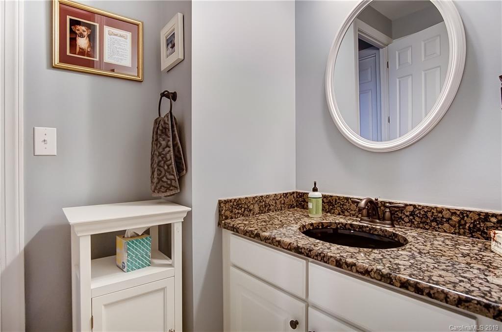18408 Dembridge Drive, Unit 21 Davidson, NC 28036 - Photo 21 of 34 a bathroom with a sink and a mirror