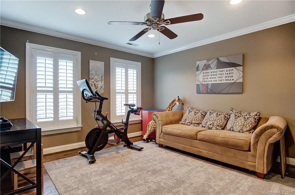 18408 Dembridge Drive, Unit 21 Davidson, NC 28036 - Photo 26 of 34 a living room with furniture and a window