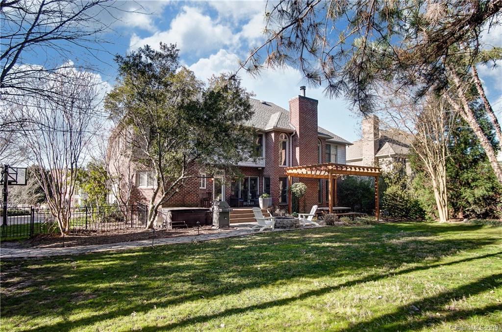 18408 Dembridge Drive, Unit 21 Davidson, NC 28036 - Photo 30 of 34 a view of a house with a yard