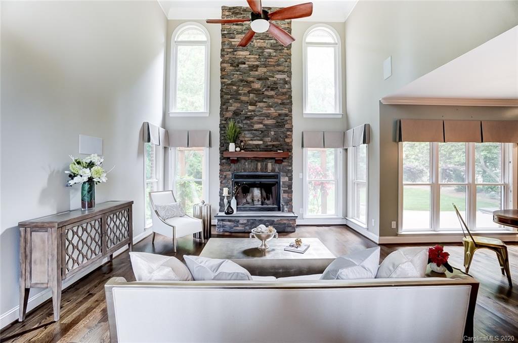 18408 Dembridge Drive, Unit 21 Davidson, NC 28036 - Photo 7 of 34 a living room with furniture and a large window