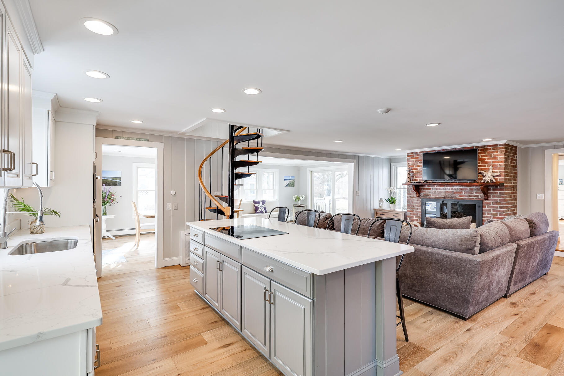 156 Commerce Road Barnstable, MA 02630 - Photo 8 of 54 a large living room with stainless steel appliances kitchen island granite countertop a couch and a view of living room