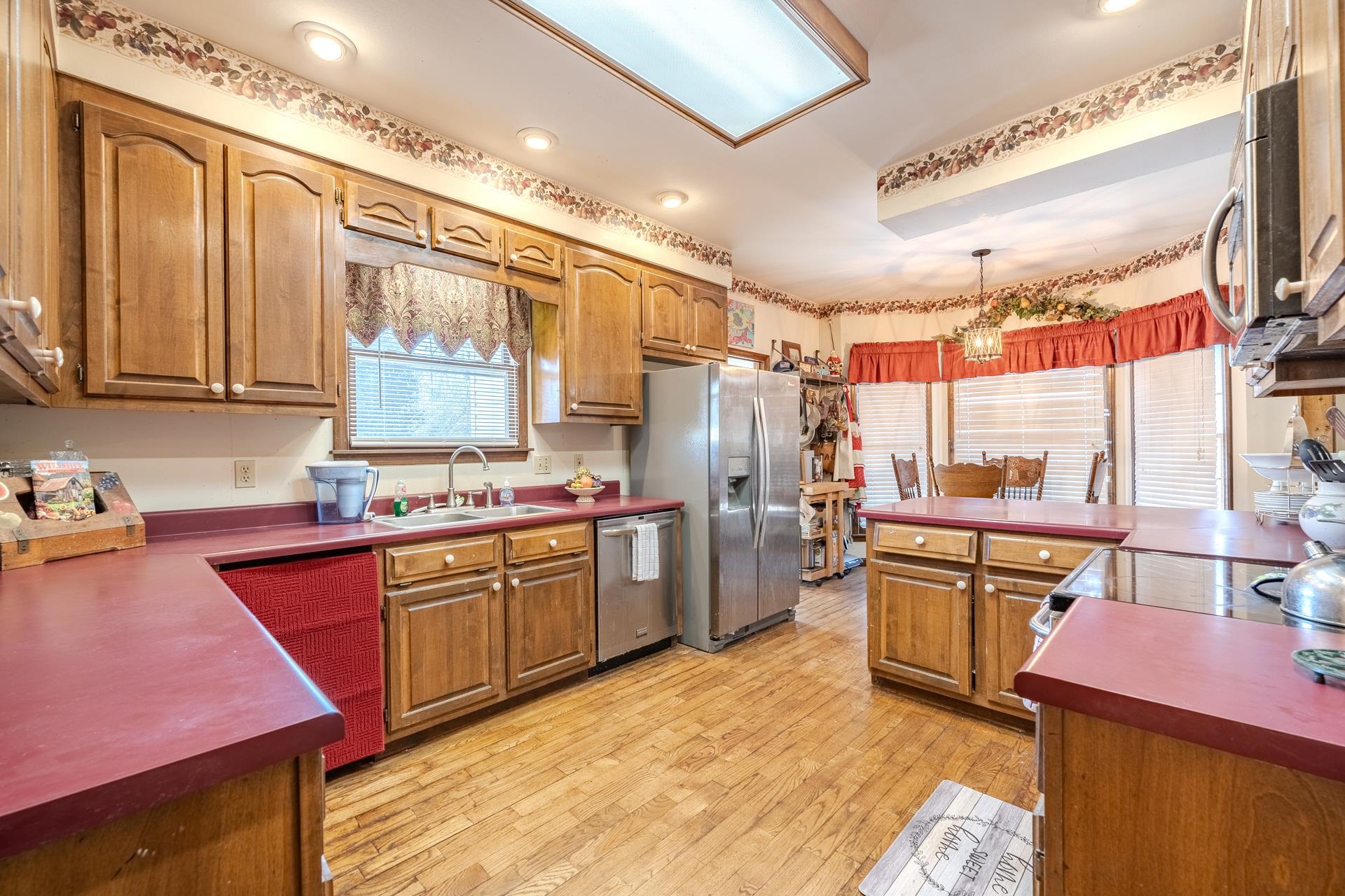 645 Wildflower Ridge Lane Savannah, TN 38372 - Photo 20 of 40 a kitchen with refrigerator sink and cabinets