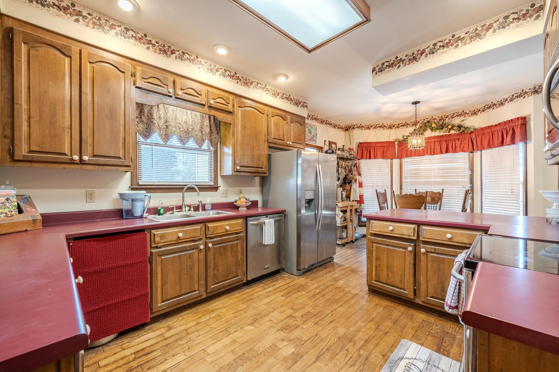 645 Wildflower Ridge Lane Savannah, TN 38372 - Photo 22 of 40 a kitchen with refrigerator a sink and cabinets