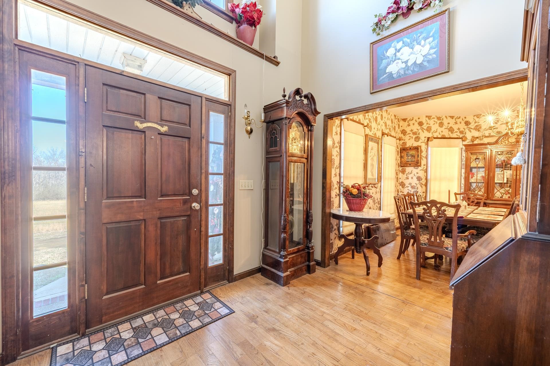 645 Wildflower Ridge Lane Savannah, TN 38372 - Photo 27 of 40 a view of a living room with furniture and floor to ceiling windows
