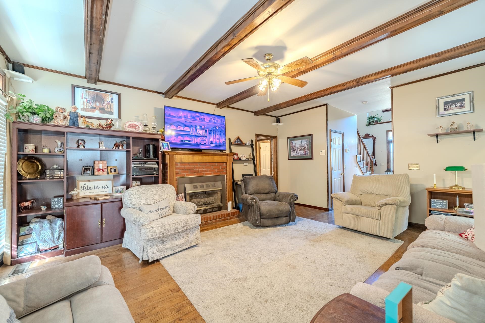 645 Wildflower Ridge Lane Savannah, TN 38372 - Photo 30 of 40 a living room with furniture fireplace and a window