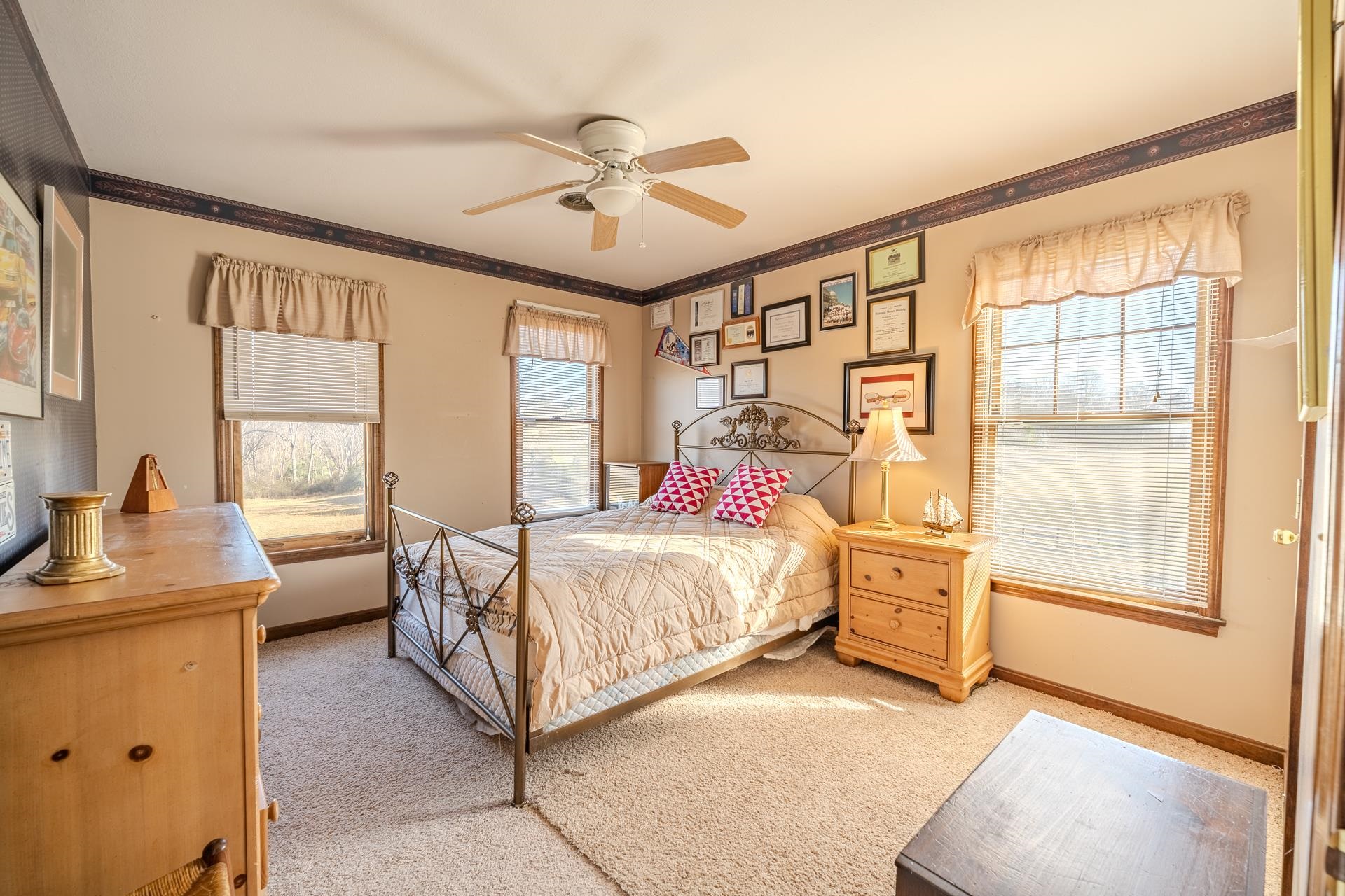 645 Wildflower Ridge Lane Savannah, TN 38372 - Photo 3 of 40 a bed room with a bed and a window