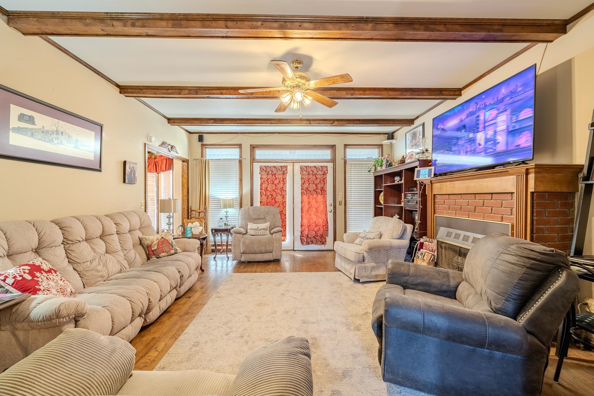 645 Wildflower Ridge Lane Savannah, TN 38372 - Photo 31 of 40 a living room with furniture and a chandelier