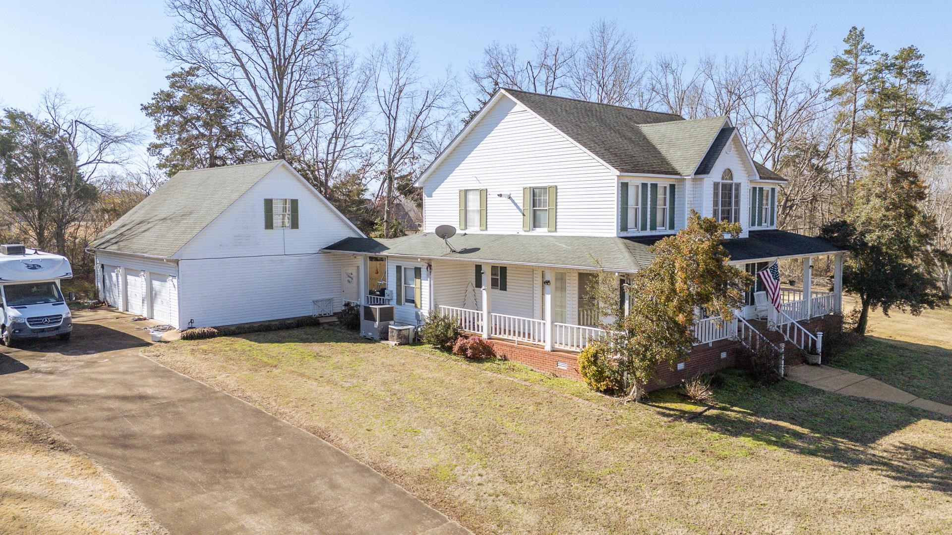 645 Wildflower Ridge Lane Savannah, TN 38372 - Photo 37 of 40 a front view of a house with a yard and garage