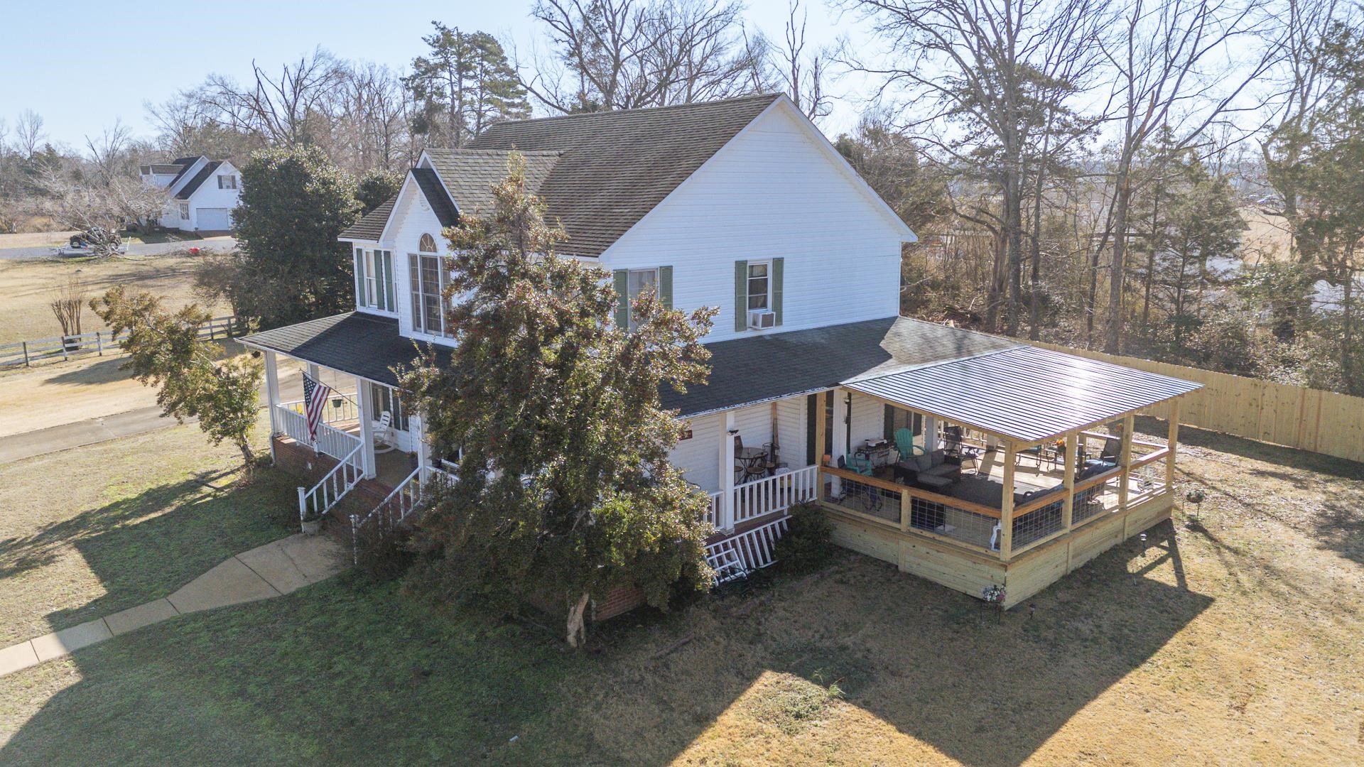 645 Wildflower Ridge Lane Savannah, TN 38372 - Photo 39 of 40 a view of a house with a yard and roof deck