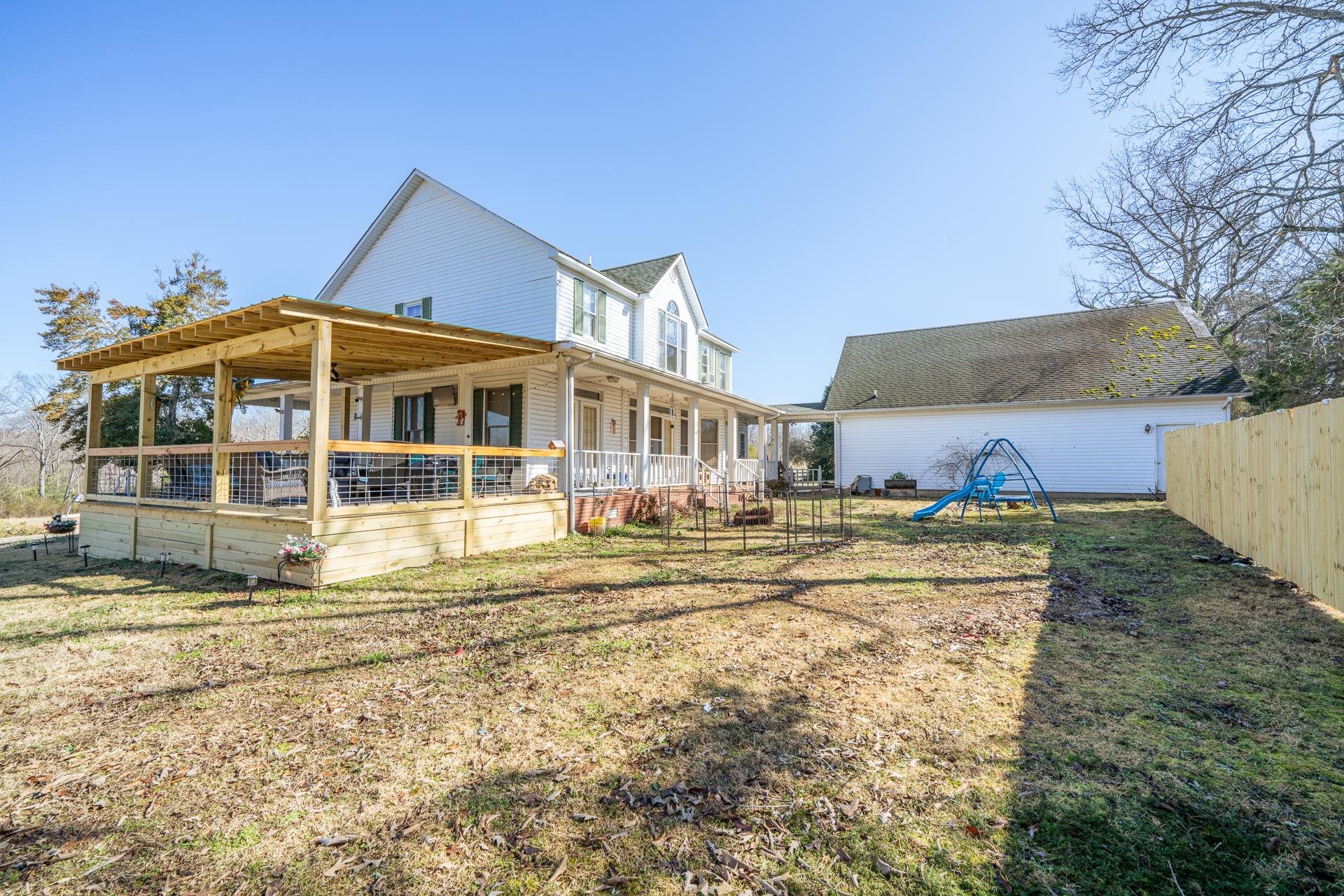 645 Wildflower Ridge Lane Savannah, TN 38372 - Photo 10 of 40 a view of a house with a yard and sitting area