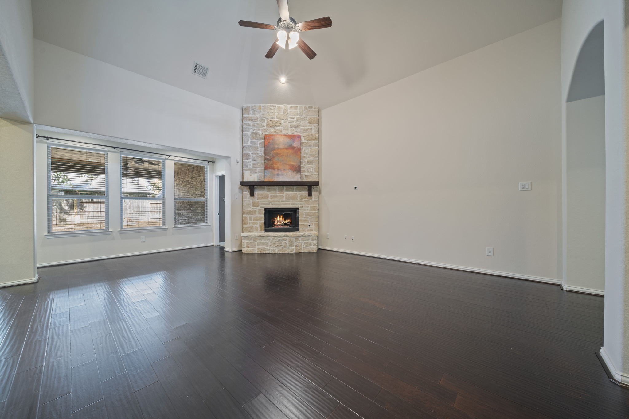8115 Spreadwing Street Conroe, TX 77385 - Photo 11 of 45 a view of empty room with wooden floor and fan