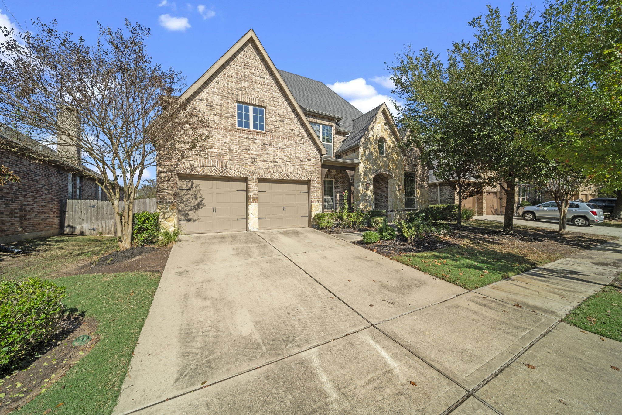 8115 Spreadwing Street Conroe, TX 77385 - Photo 2 of 45 a front view of a house with a yard
