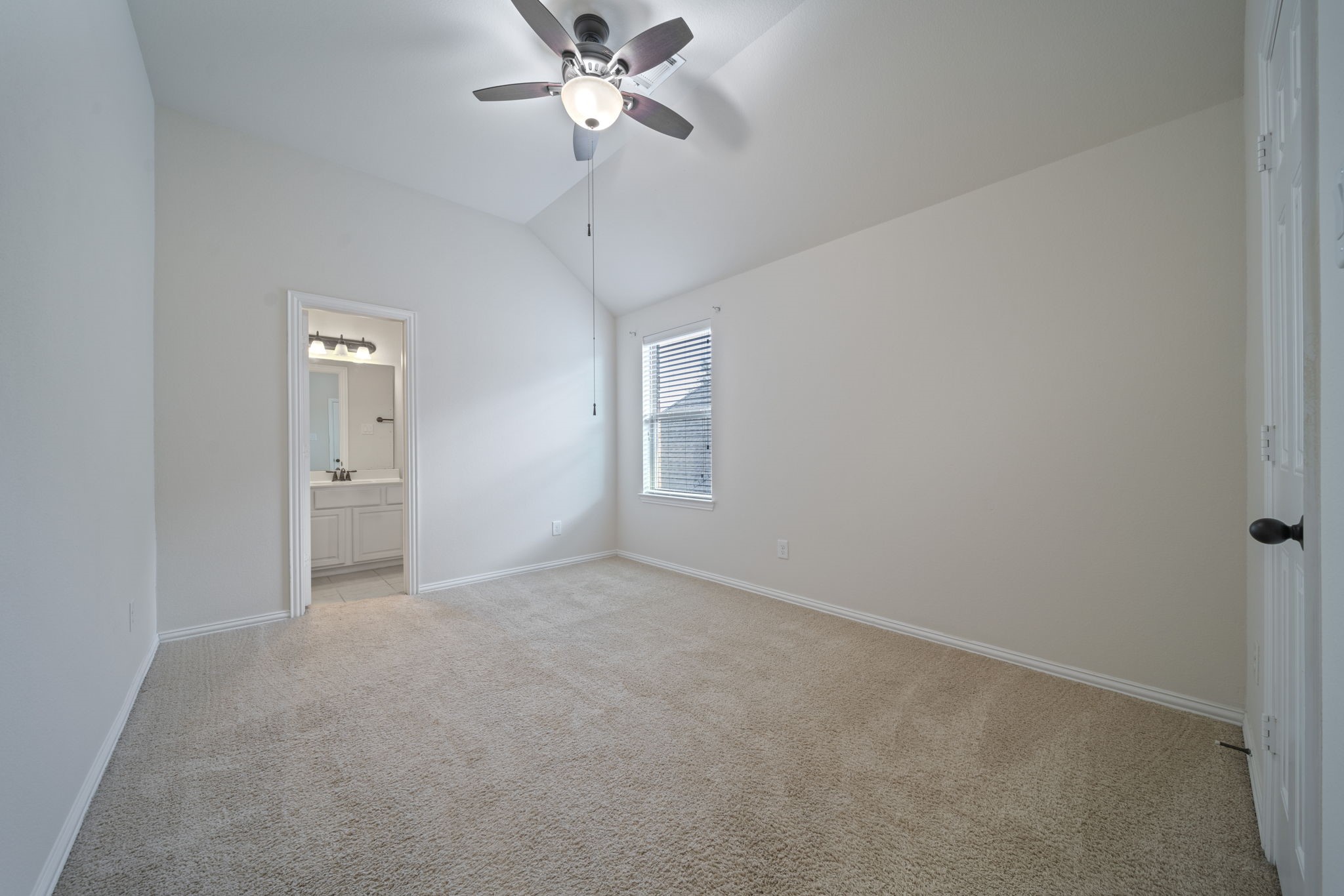 8115 Spreadwing Street Conroe, TX 77385 - Photo 32 of 45 a view of an empty room with a window