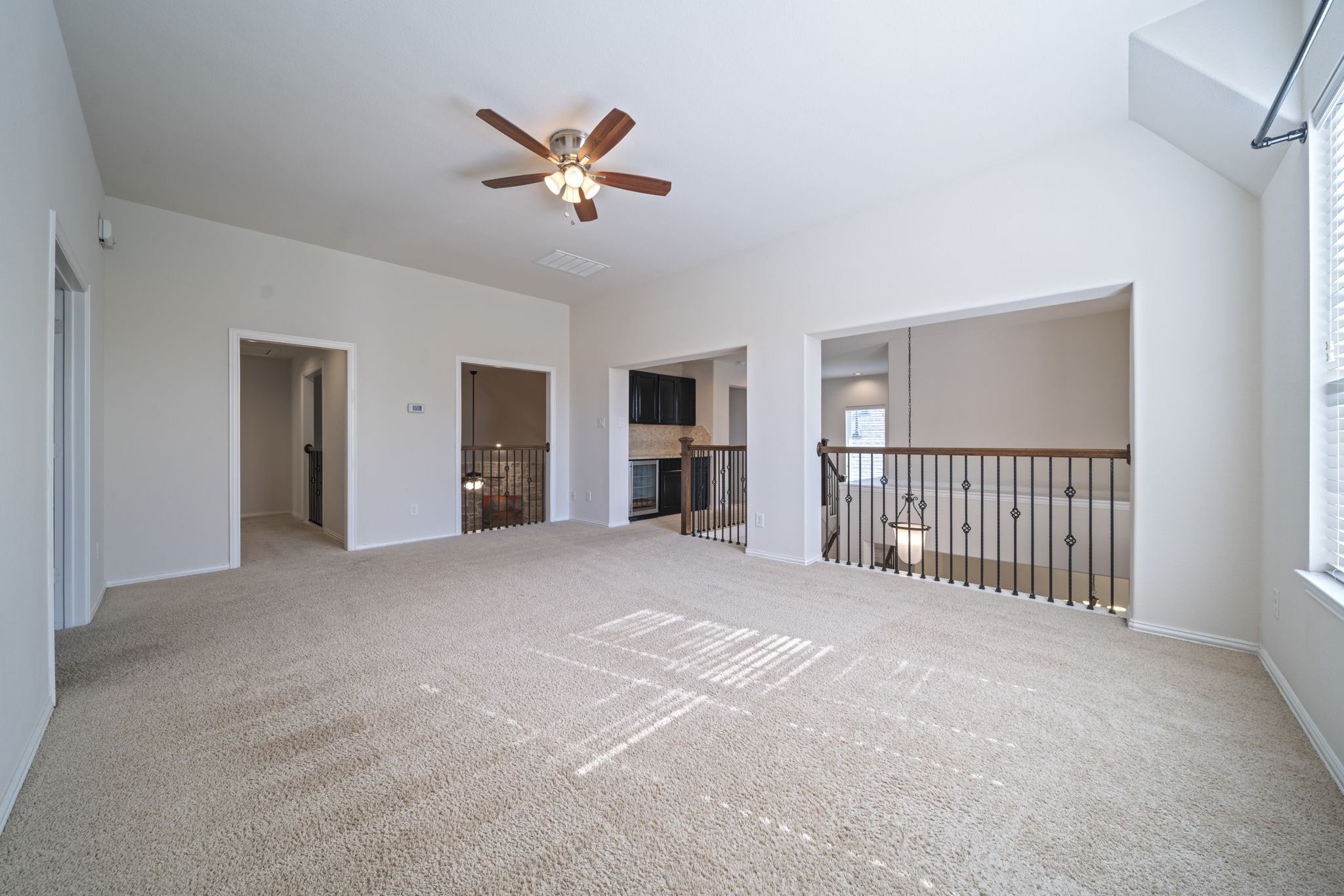 8115 Spreadwing Street Conroe, TX 77385 - Photo 37 of 45 a view of a livingroom with a ceiling fan and window