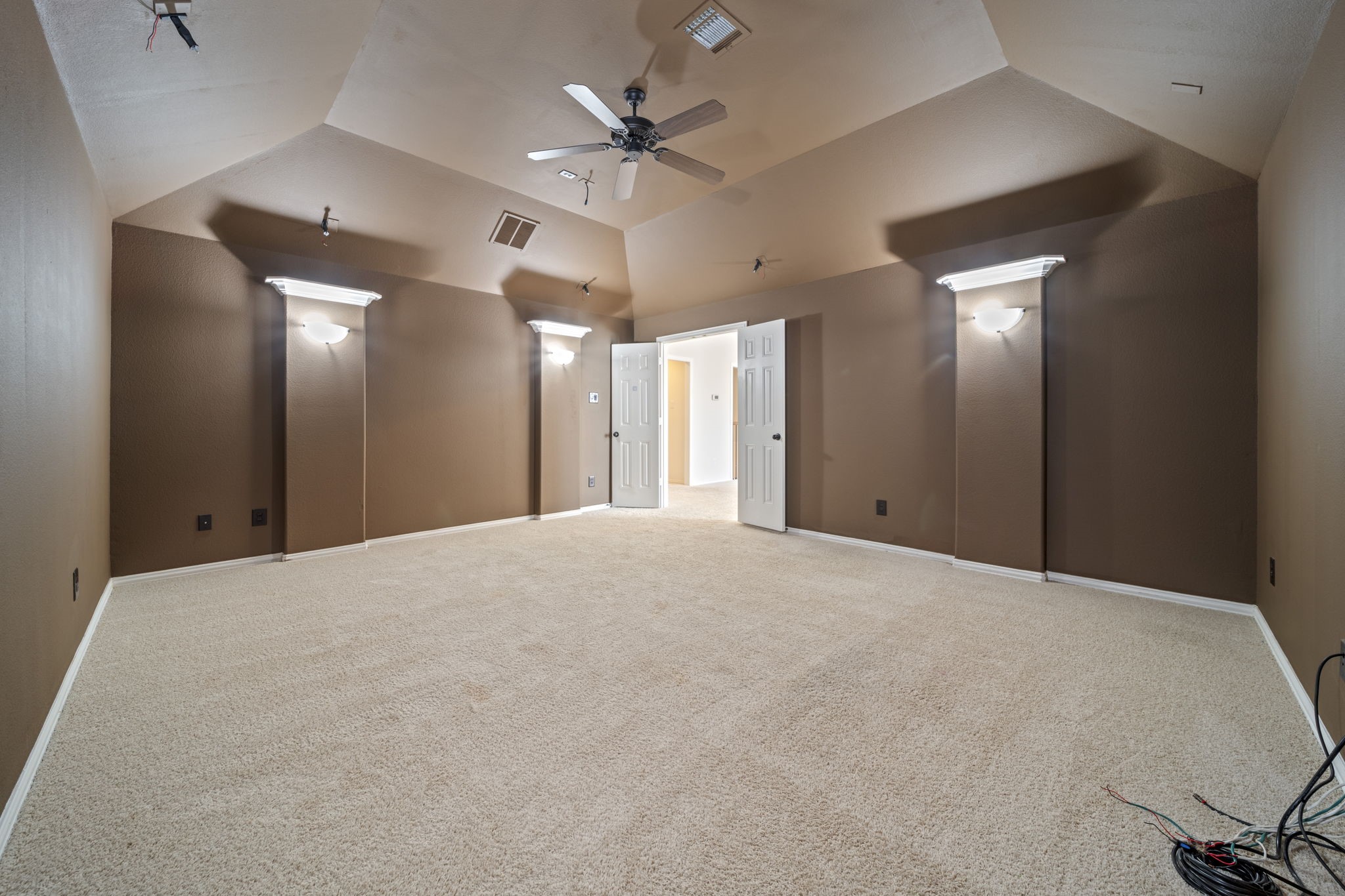 8115 Spreadwing Street Conroe, TX 77385 - Photo 39 of 45 a view of a livingroom with a chandelier fan