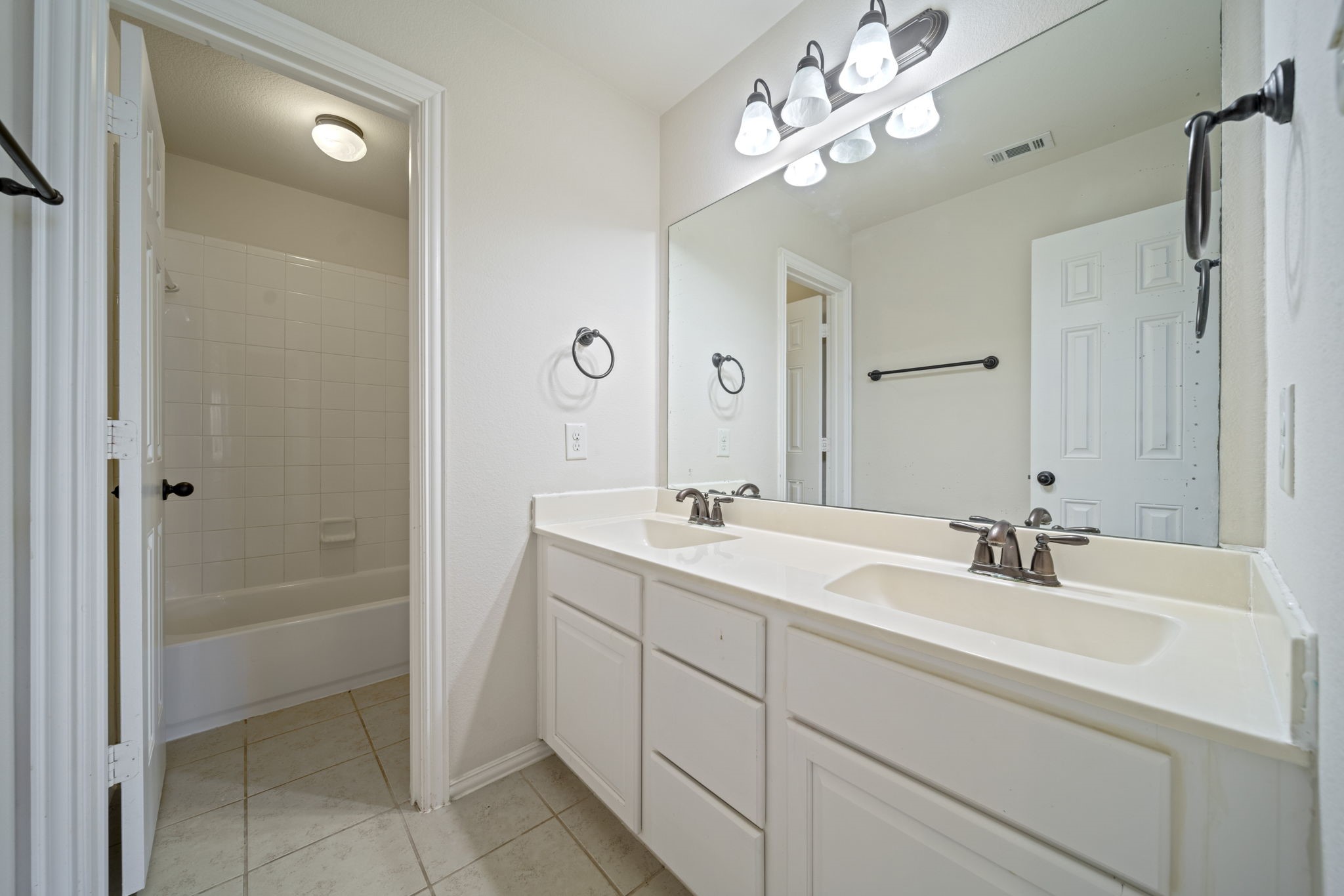8115 Spreadwing Street Conroe, TX 77385 - Photo 42 of 45 a bathroom with a sink tub and a mirror