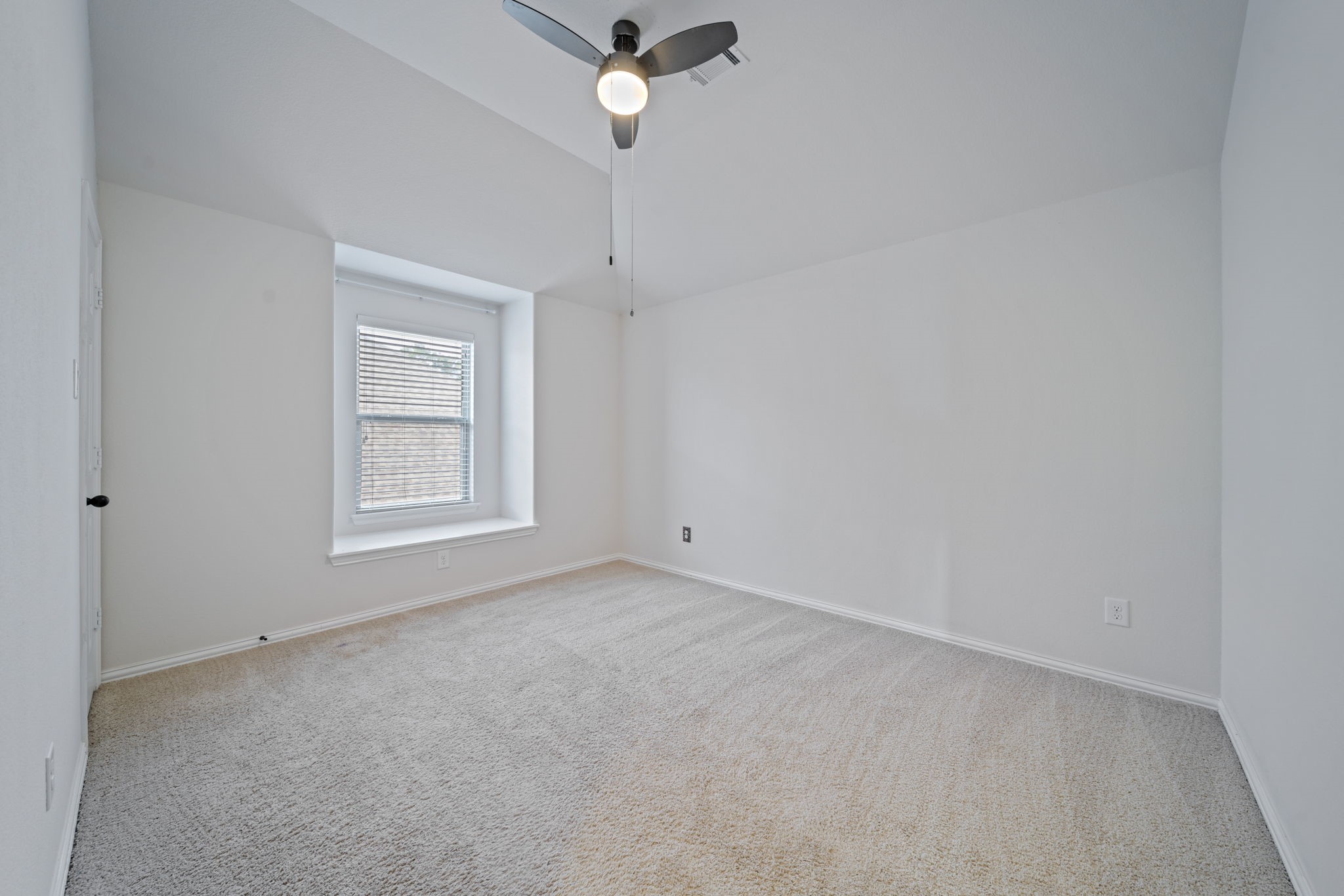 8115 Spreadwing Street Conroe, TX 77385 - Photo 43 of 45 an empty room with a window