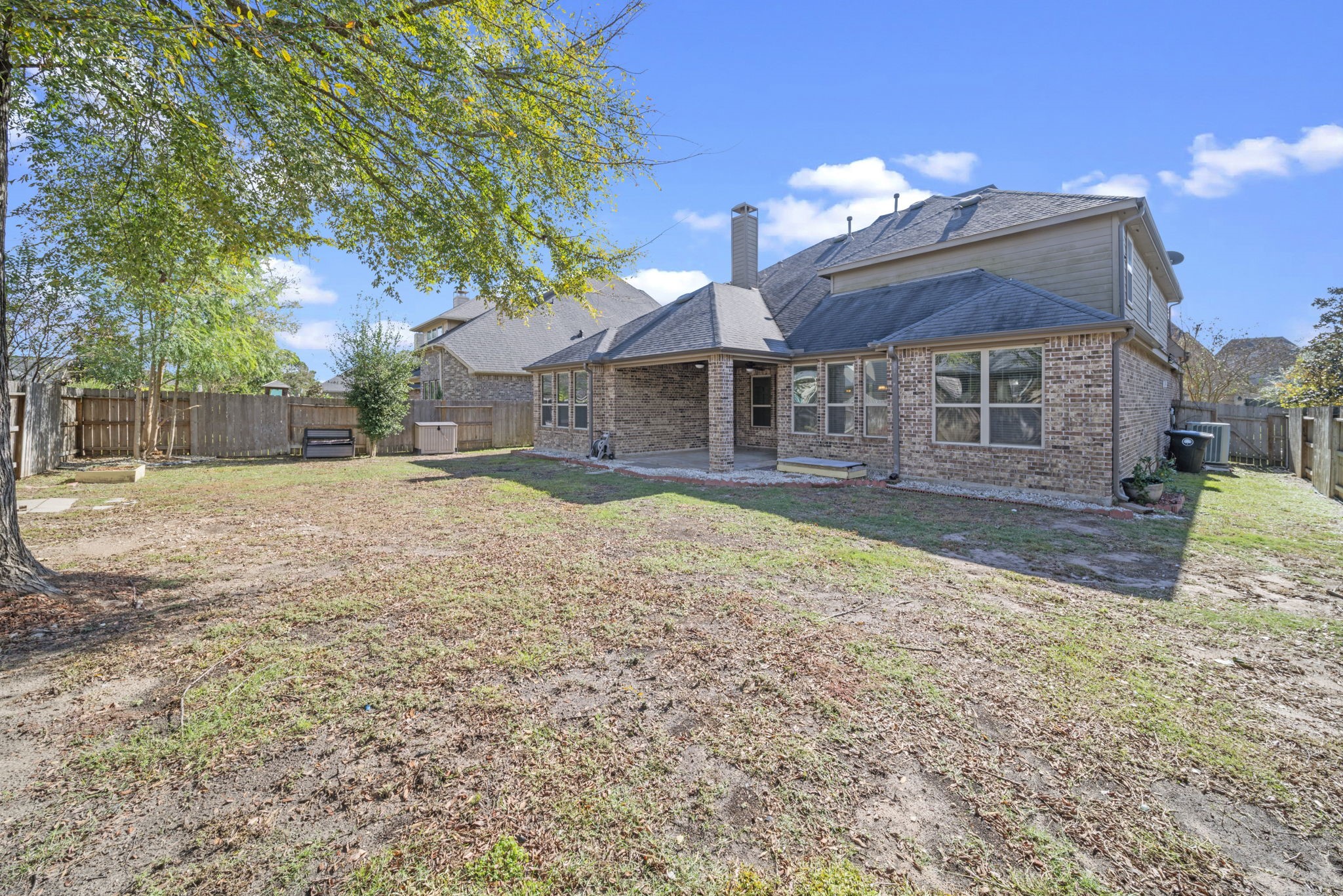 8115 Spreadwing Street Conroe, TX 77385 - Photo 45 of 45 a view of a house with a yard