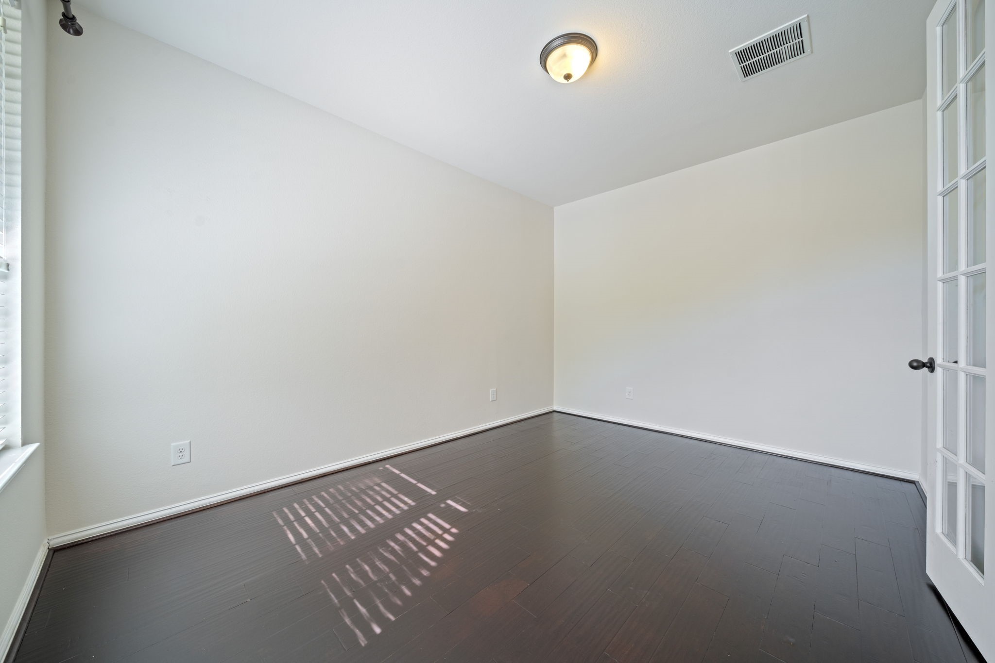 8115 Spreadwing Street Conroe, TX 77385 - Photo 8 of 45 an empty room with a workbench