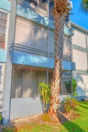 8351 Sands Point Boulevard, Unit A104 Tamarac, FL 33321 - Photo 3 of 18 a view of a house with a yard