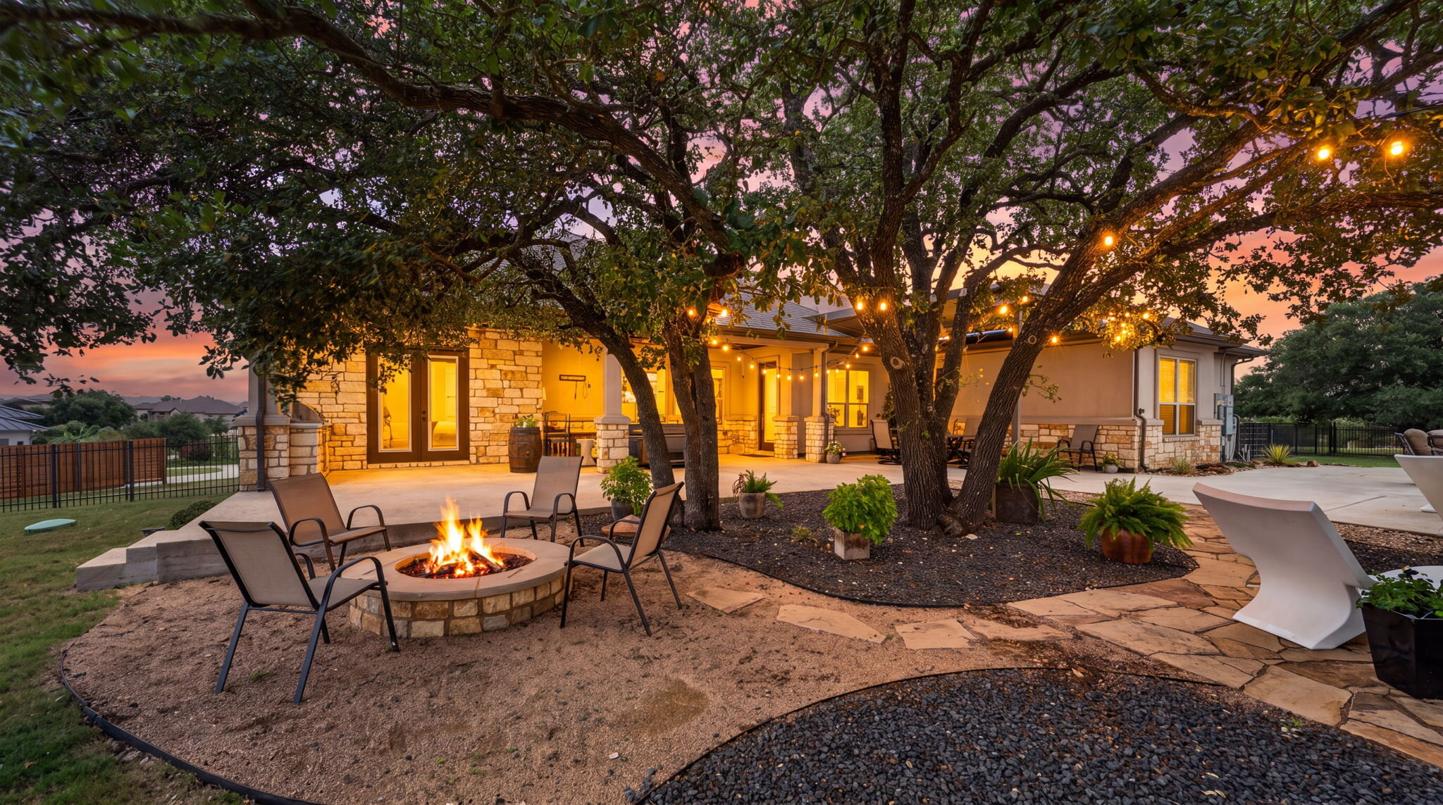 105 Coopers Hill Road Georgetown, TX 78633 - Photo 34 of 40 a backyard of a house with table and chairs