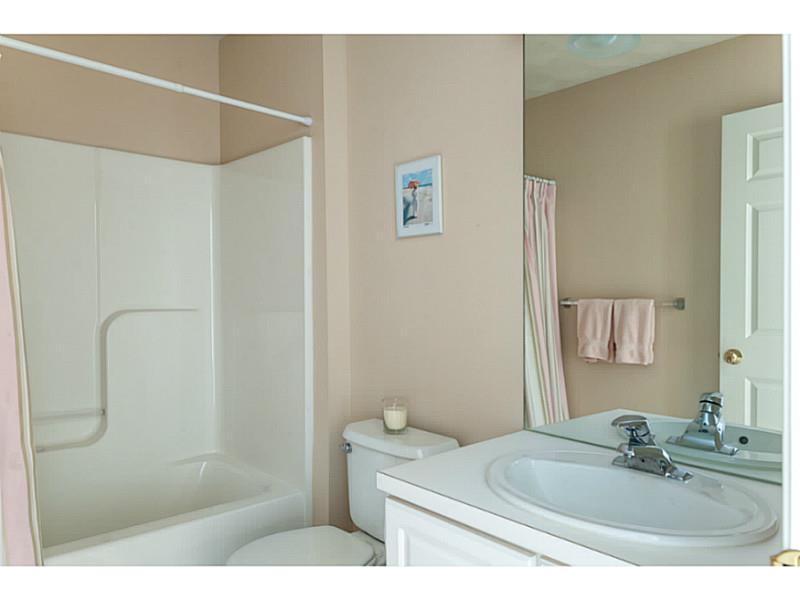 434 Sleepy Hollow Farm Road Warwick, RI 02886 - Photo 20 of 24 Bathroom. The hall bathroom offers a tub/shower combination and a single sink vanity.