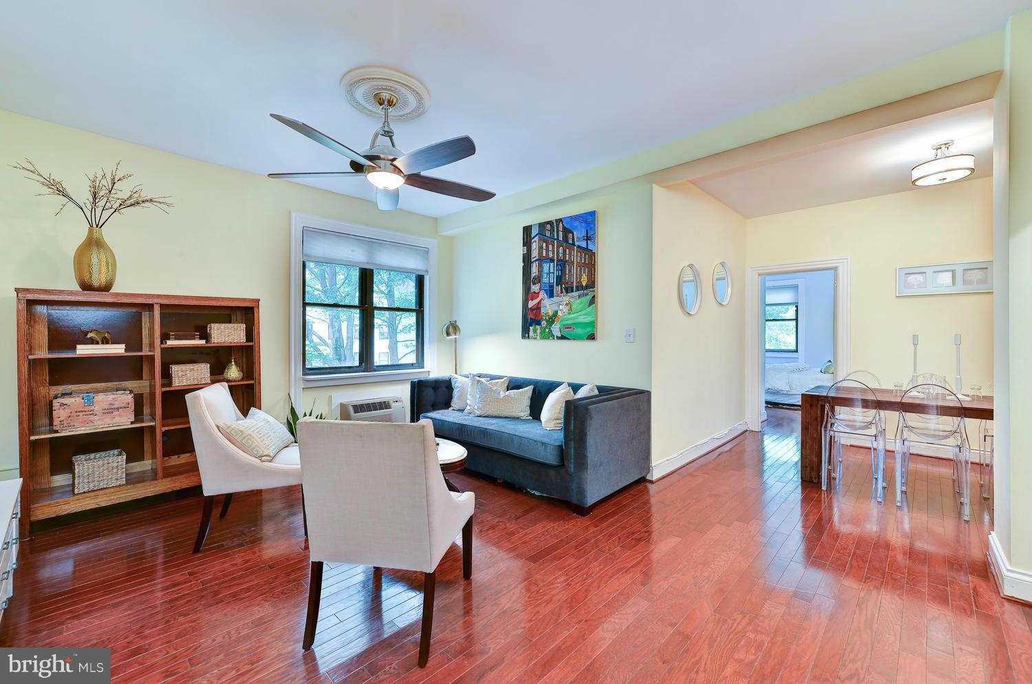 3100 Connecticut Avenue Northwest, Unit 304 Washington, DC 20008 - Photo 1 of 15 a living room with furniture and a wooden floor
