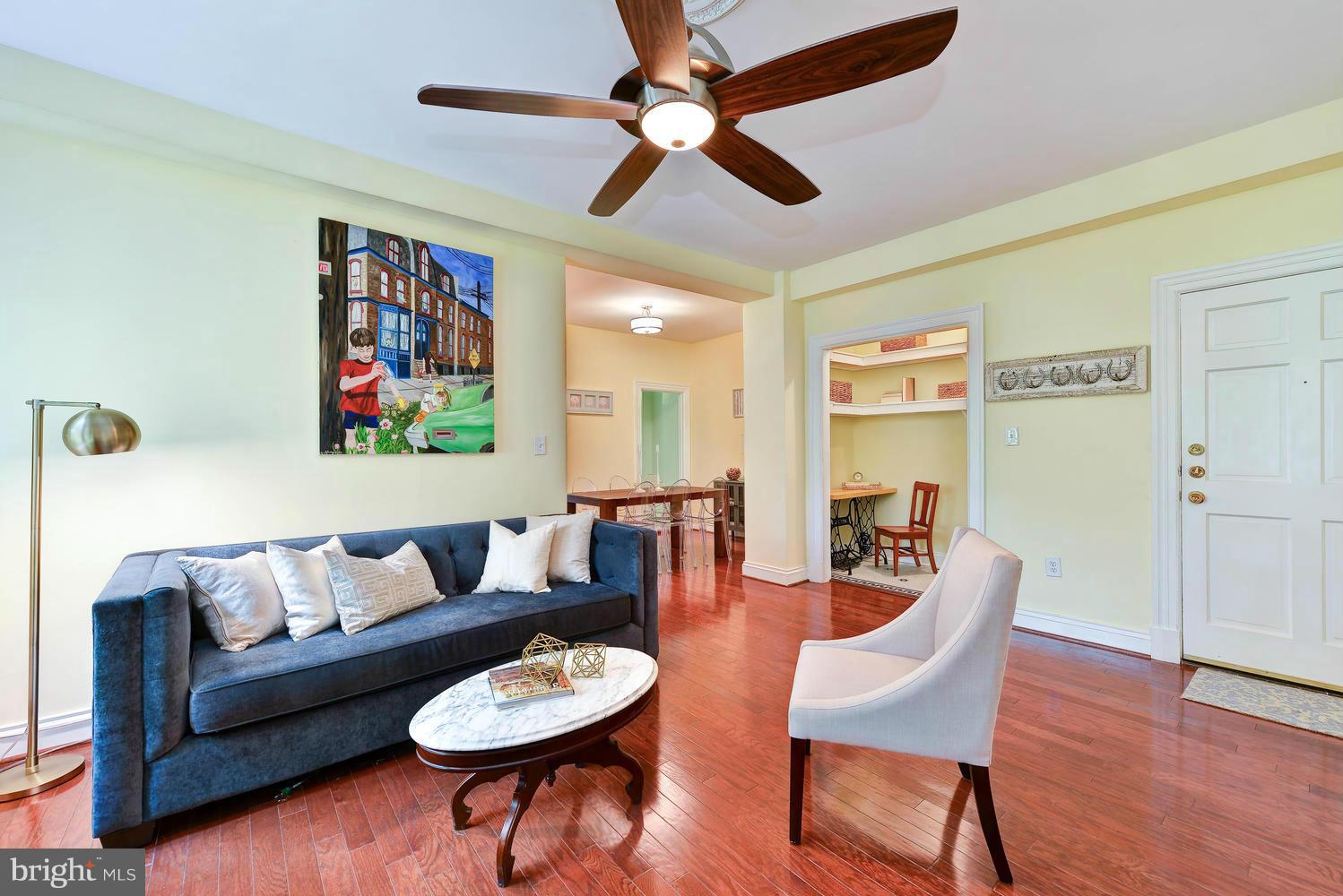 3100 Connecticut Avenue Northwest, Unit 304 Washington, DC 20008 - Photo 3 of 15 a living room with furniture and a wooden floor