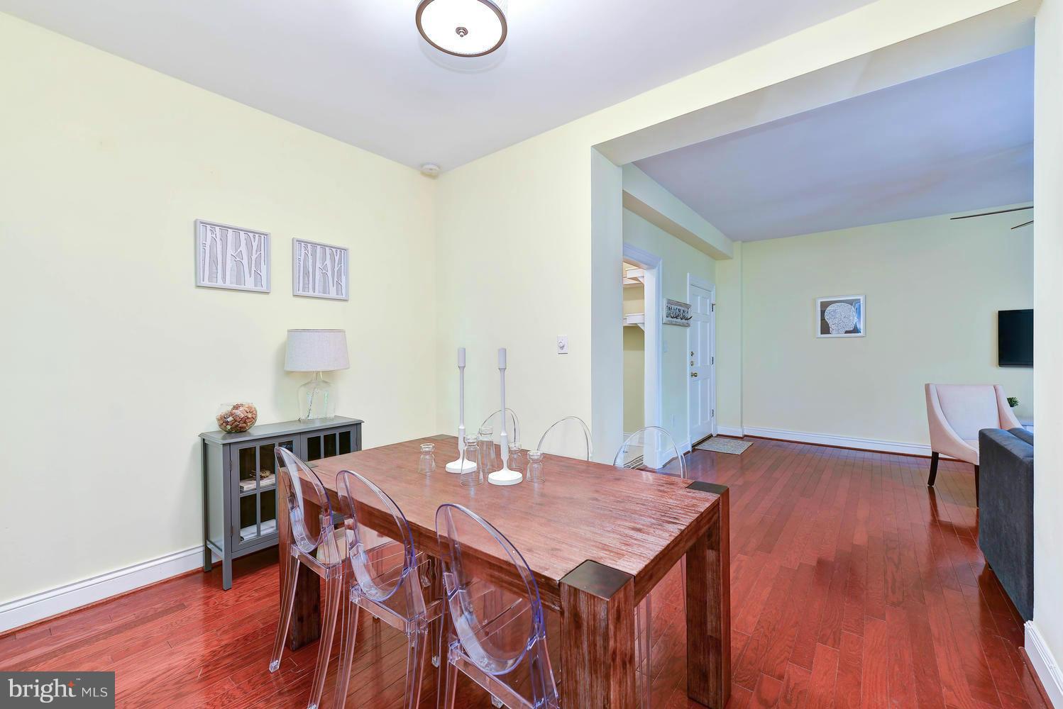 3100 Connecticut Avenue Northwest, Unit 304 Washington, DC 20008 - Photo 4 of 15 a view of a dining room with furniture and wooden floor