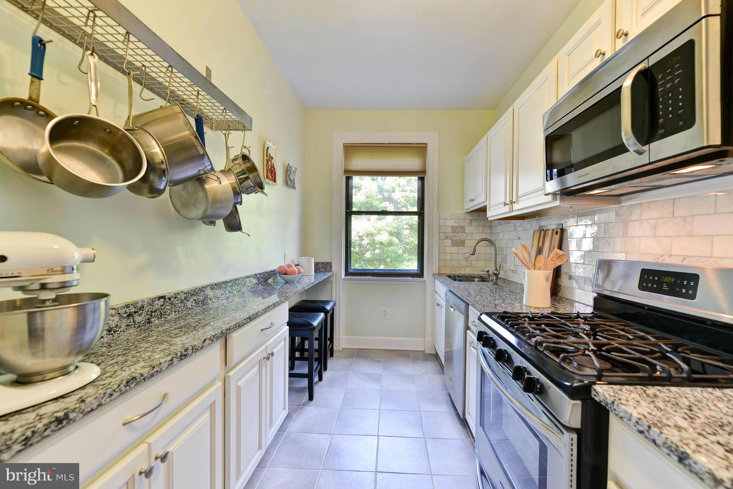 3100 Connecticut Avenue Northwest, Unit 304 Washington, DC 20008 - Photo 5 of 15 a kitchen with a stove and a sink