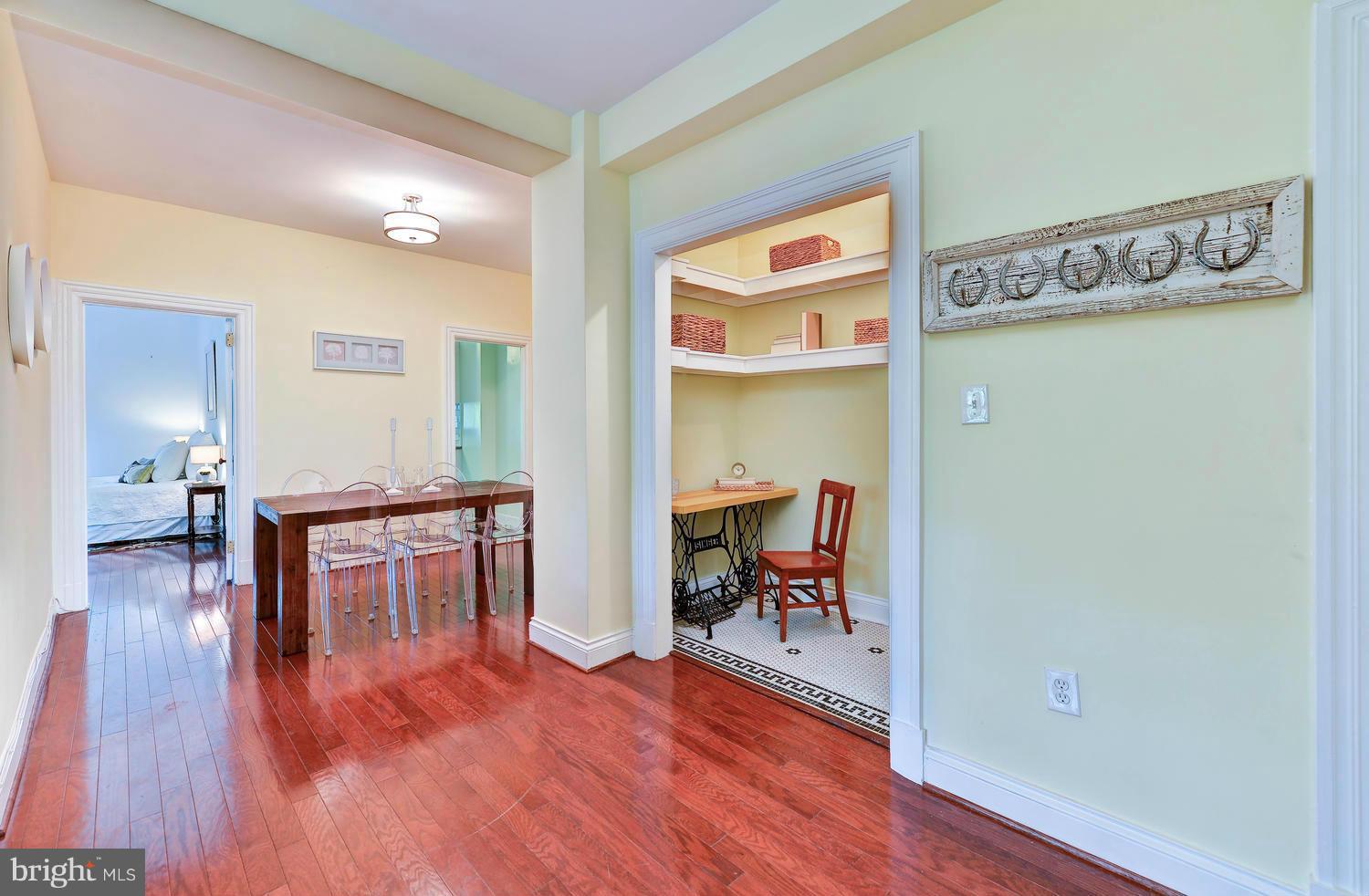 3100 Connecticut Avenue Northwest, Unit 304 Washington, DC 20008 - Photo 7 of 15 a view of a hallway to a livingroom with furniture and wooden floor