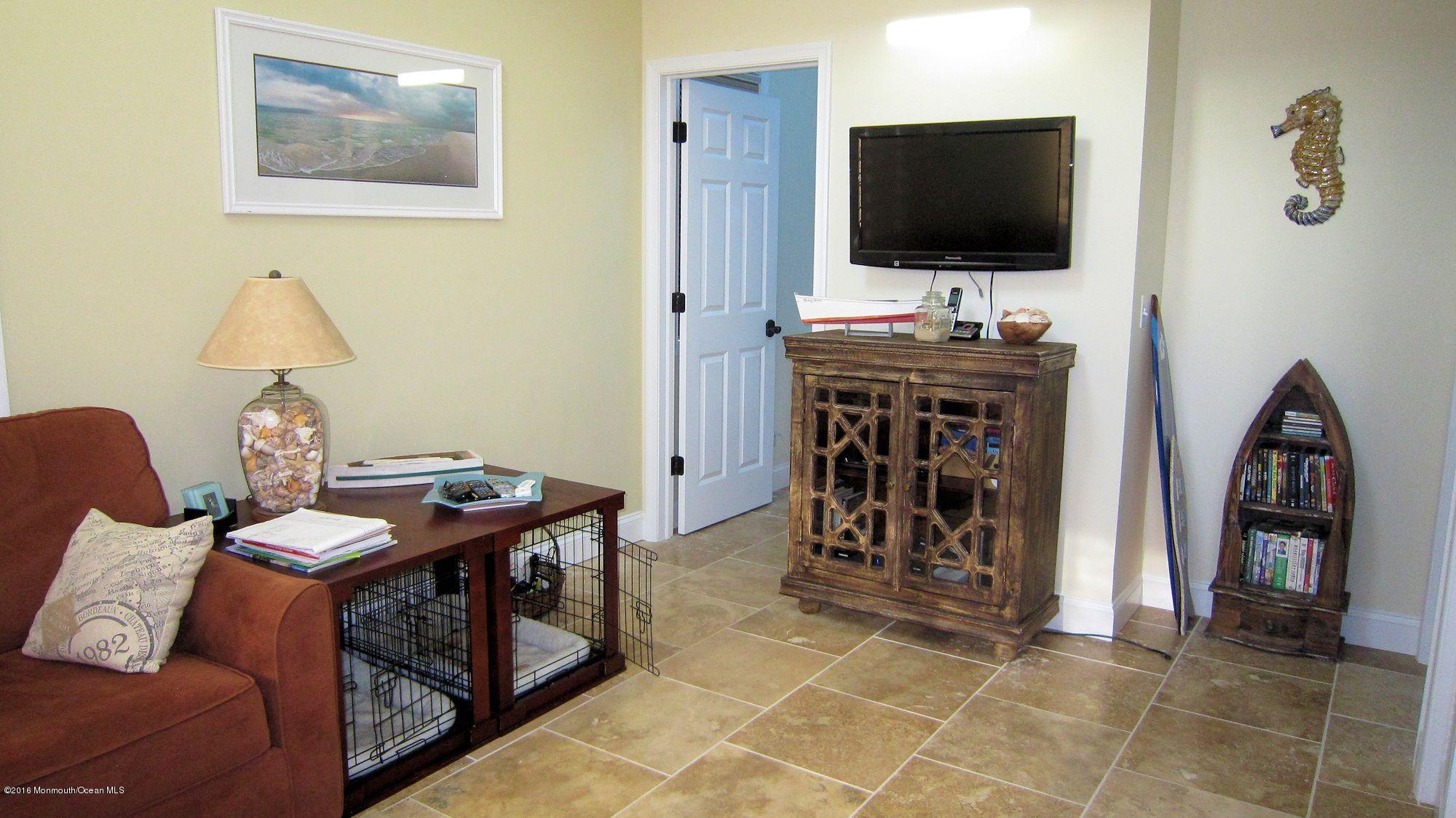 104 West Plover Way Lavallette, NJ 08735 - Photo 3 of 12 a view of a livingroom with furniture and a flat screen tv