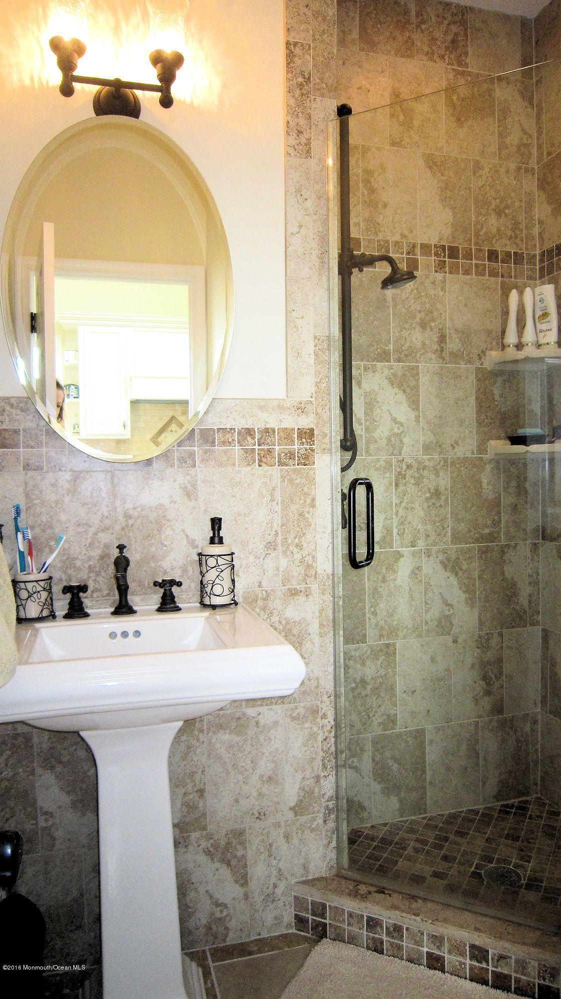 104 West Plover Way Lavallette, NJ 08735 - Photo 5 of 12 a bathroom with a sink and a mirror