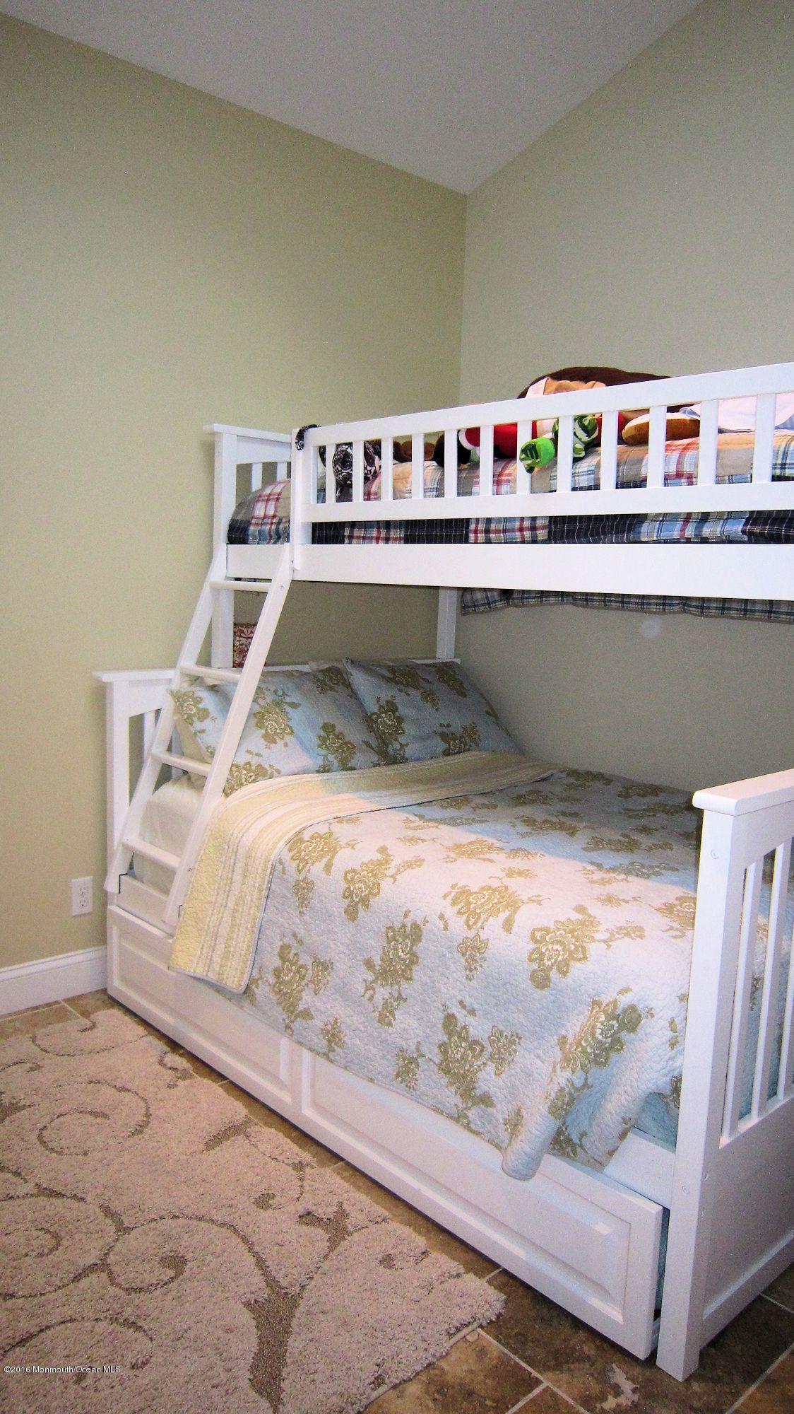 104 West Plover Way Lavallette, NJ 08735 - Photo 10 of 12 a room with wooden floor and shelf