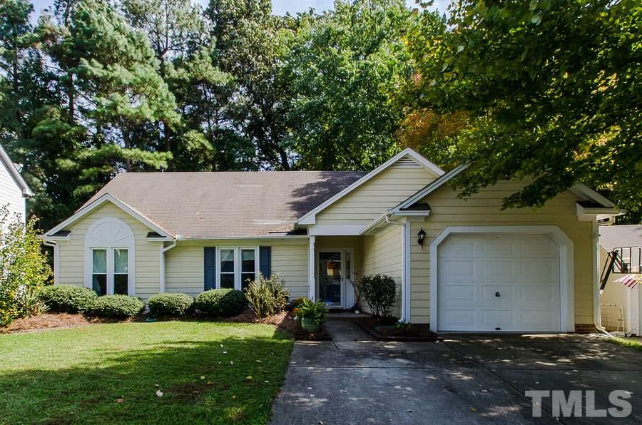 5521 Edgebury Road Raleigh, NC 27613 - Photo 1 of 19 a front view of a house with a garden