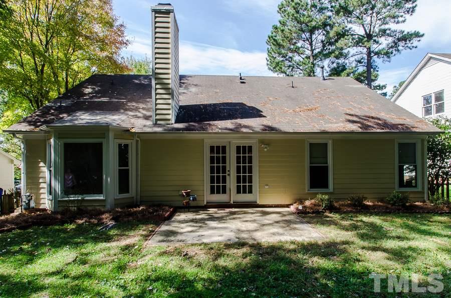 5521 Edgebury Road Raleigh, NC 27613 - Photo 16 of 19 a front view of a house with garden