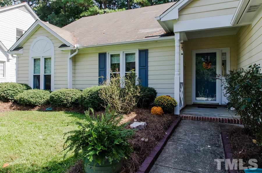 5521 Edgebury Road Raleigh, NC 27613 - Photo 3 of 19 a front view of a house with garden