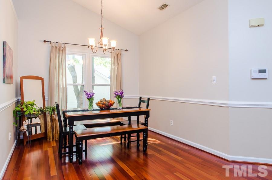 5521 Edgebury Road Raleigh, NC 27613 - Photo 5 of 19 a view of a dining room with furniture window and wooden floor