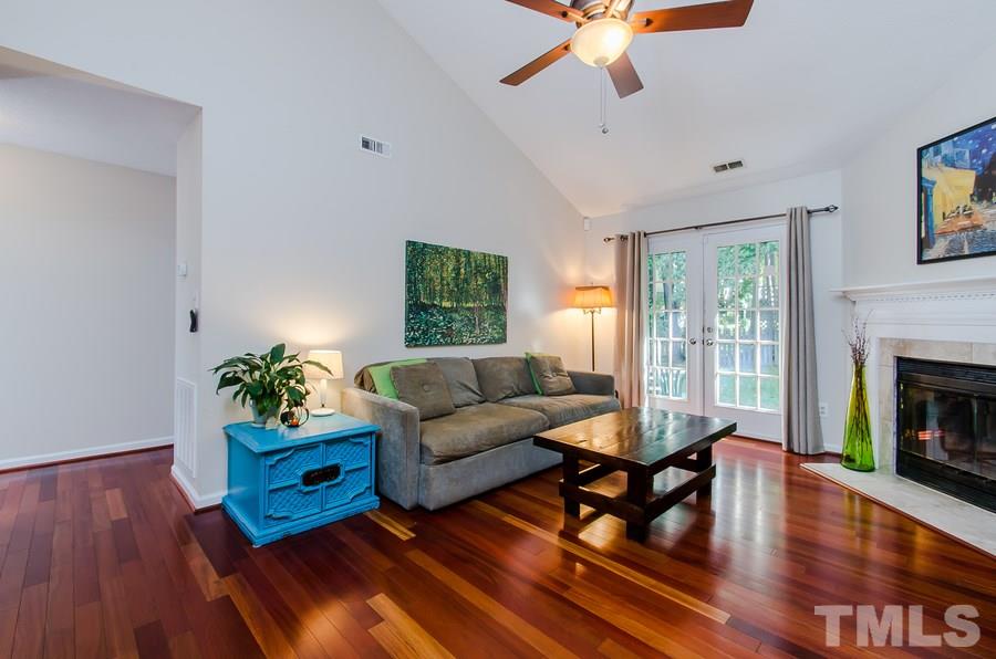 5521 Edgebury Road Raleigh, NC 27613 - Photo 10 of 19 a living room with furniture and a fireplace