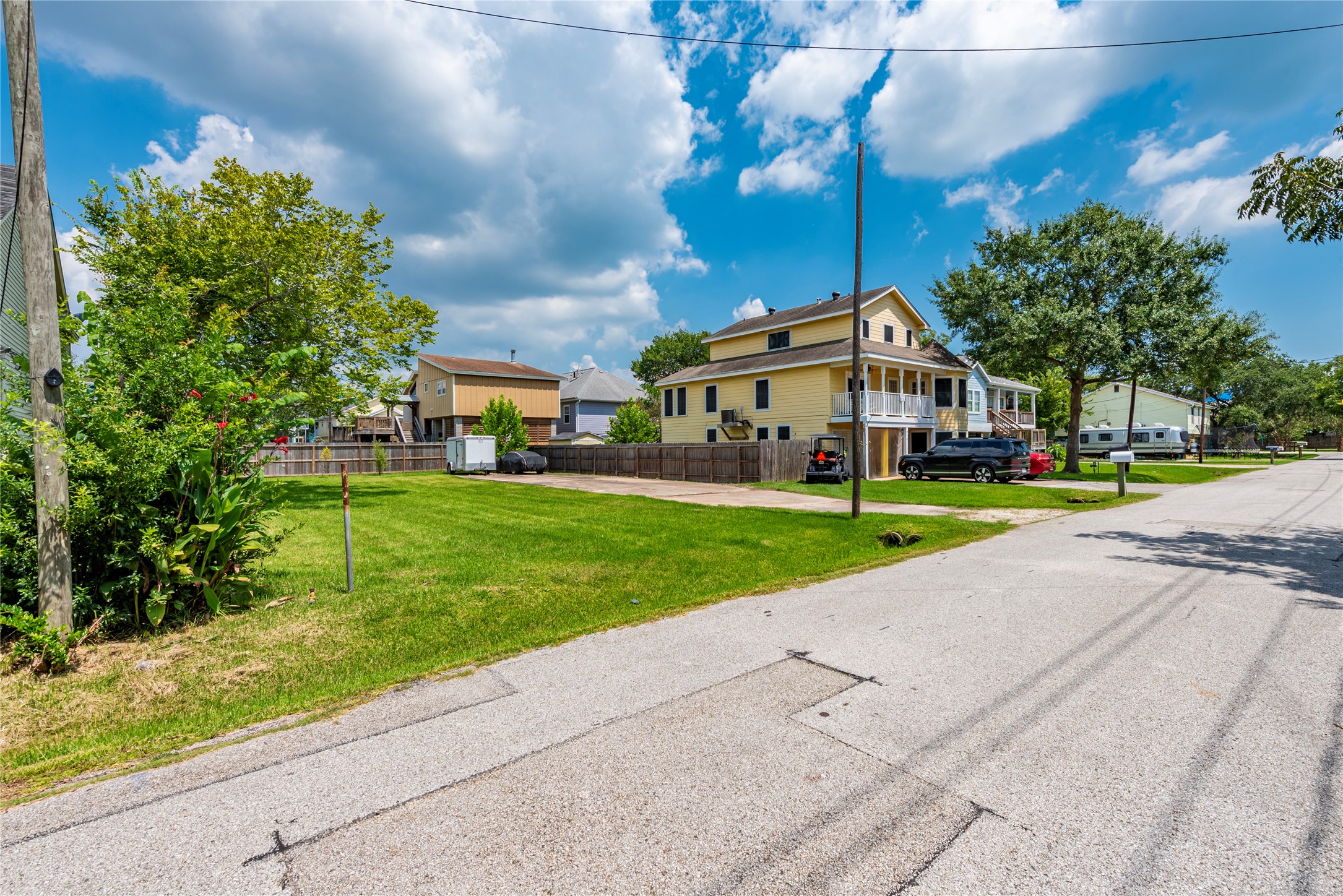 822 Cedar Road Clear Lake Shores, TX 77565 - Photo 5 of 20 a view of house with garden and tall trees