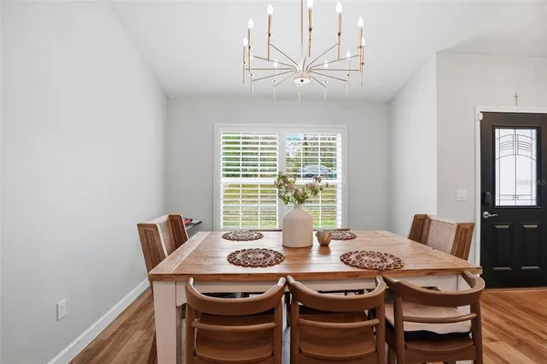 a view of a dining room with furniture window and outside view