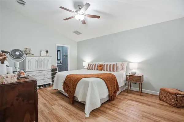 a bed room with a bed and a chair